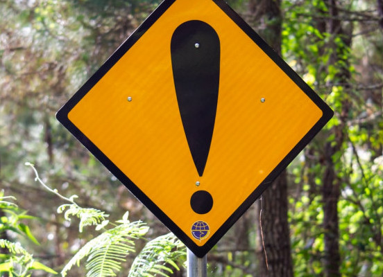 caution sign in the woods